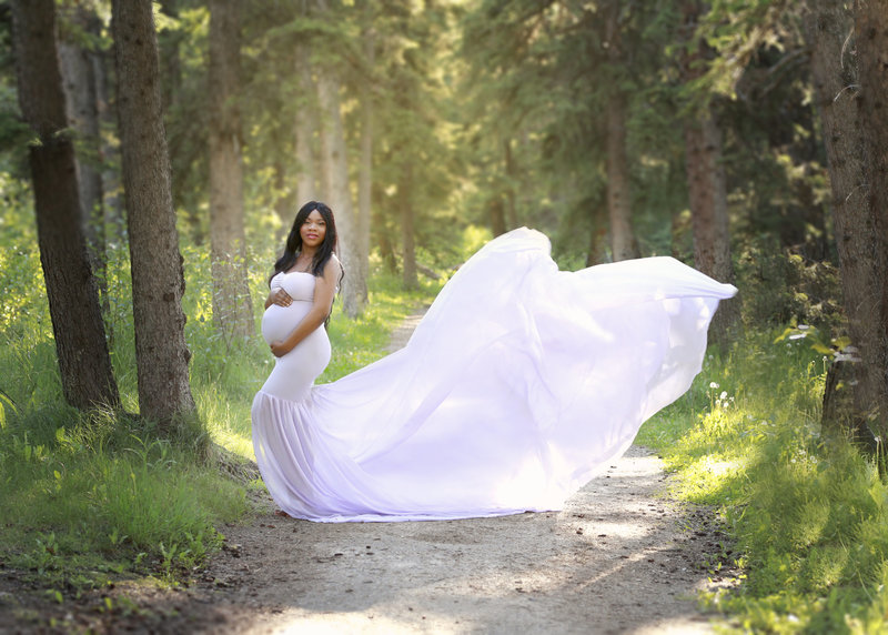 Calgary Maternity Photopgrapher mama to be in a purple dress outdoors in the summer