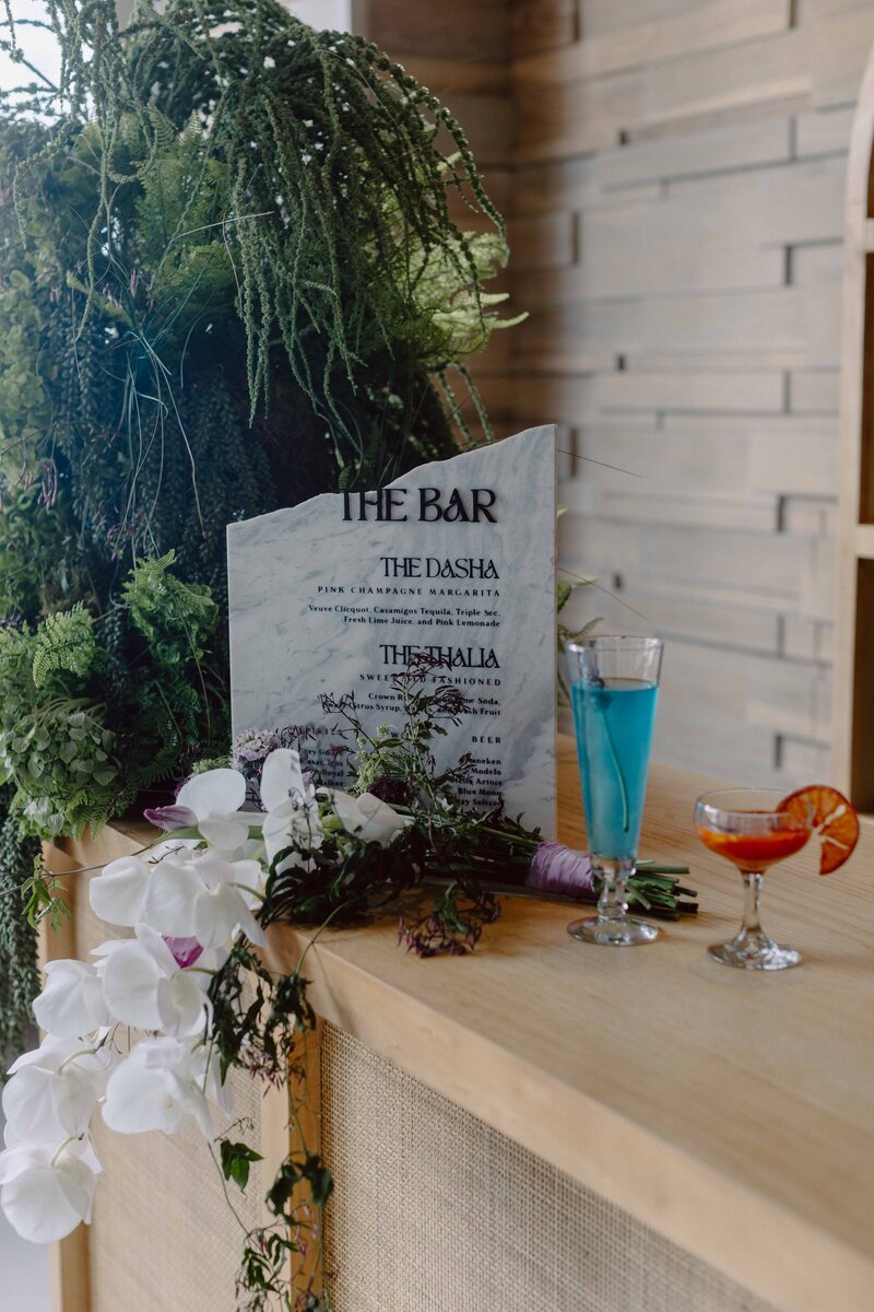Two half arched welcome signs for a wedding
