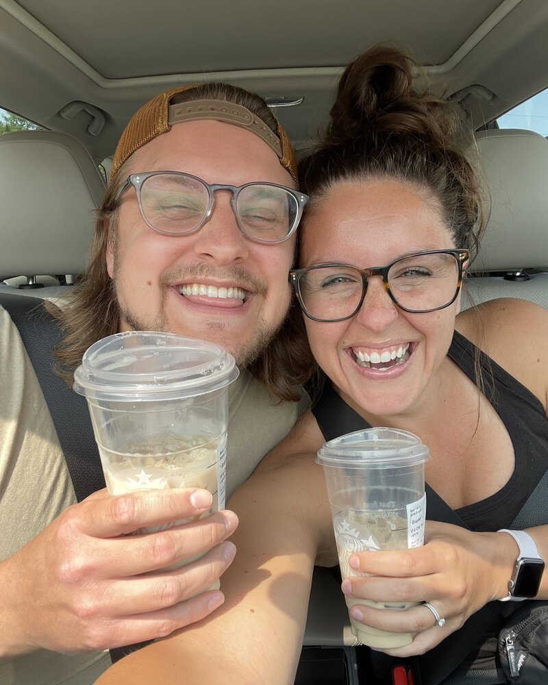 Morgan, a wedding photographer in Duluth, MN, smiling with her husband, Bradyn, as they enjoy Starbucks coffee, featured on the About page