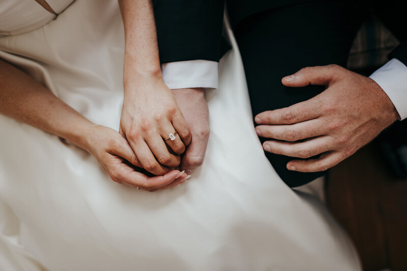Bride and groom holding hands at Agape oaks wedding