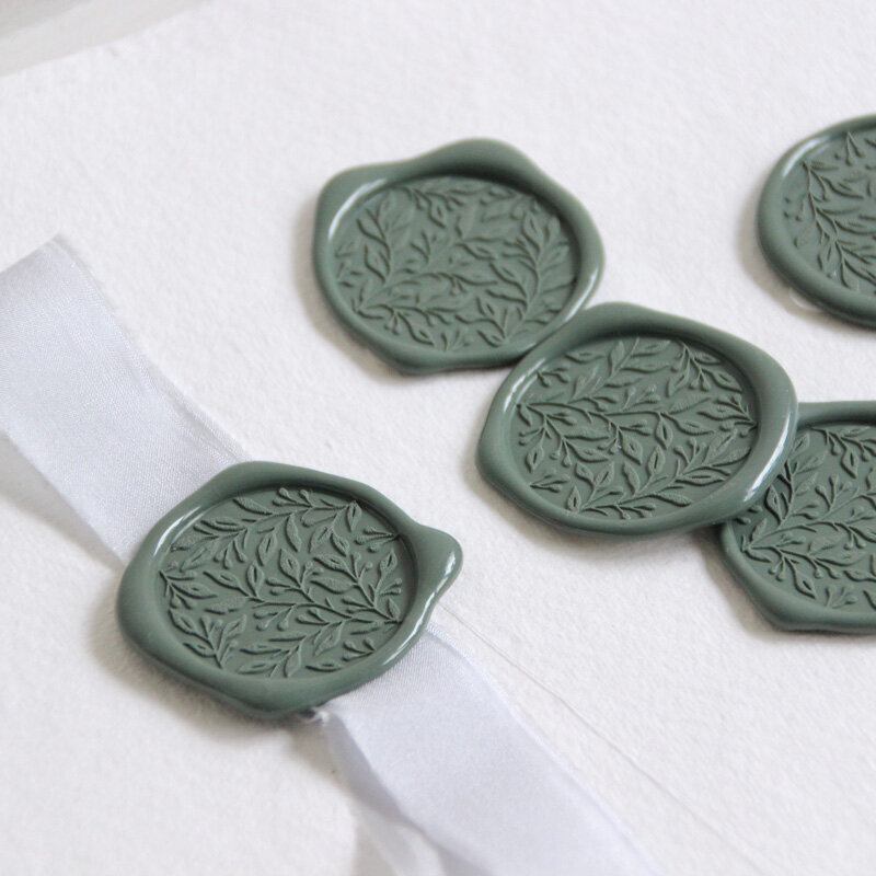 green wax seals and silk ribbon