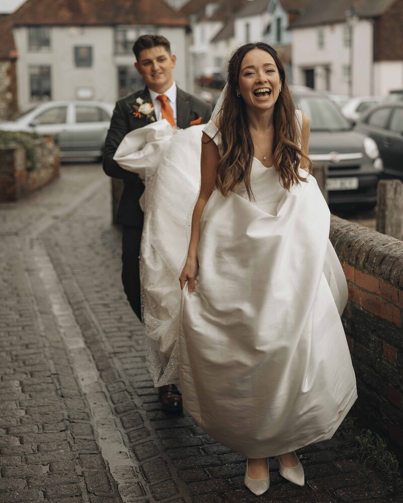 bride laughing while walking