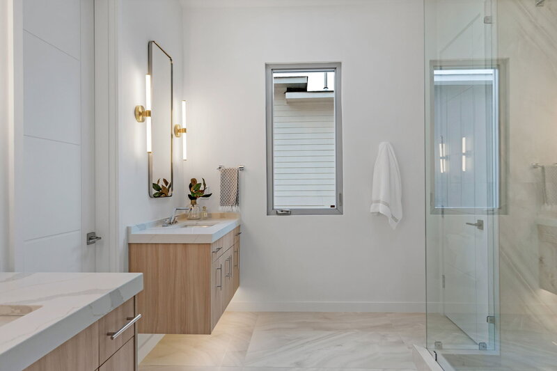 modern primary bathroom design by Gracious Home Interiors