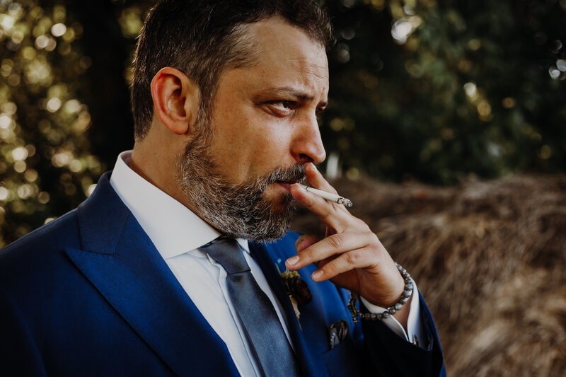 groom smoking a cigarette