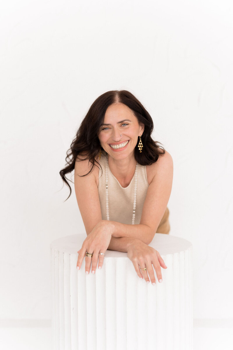 A portrait of a self love coach and yoga teacher