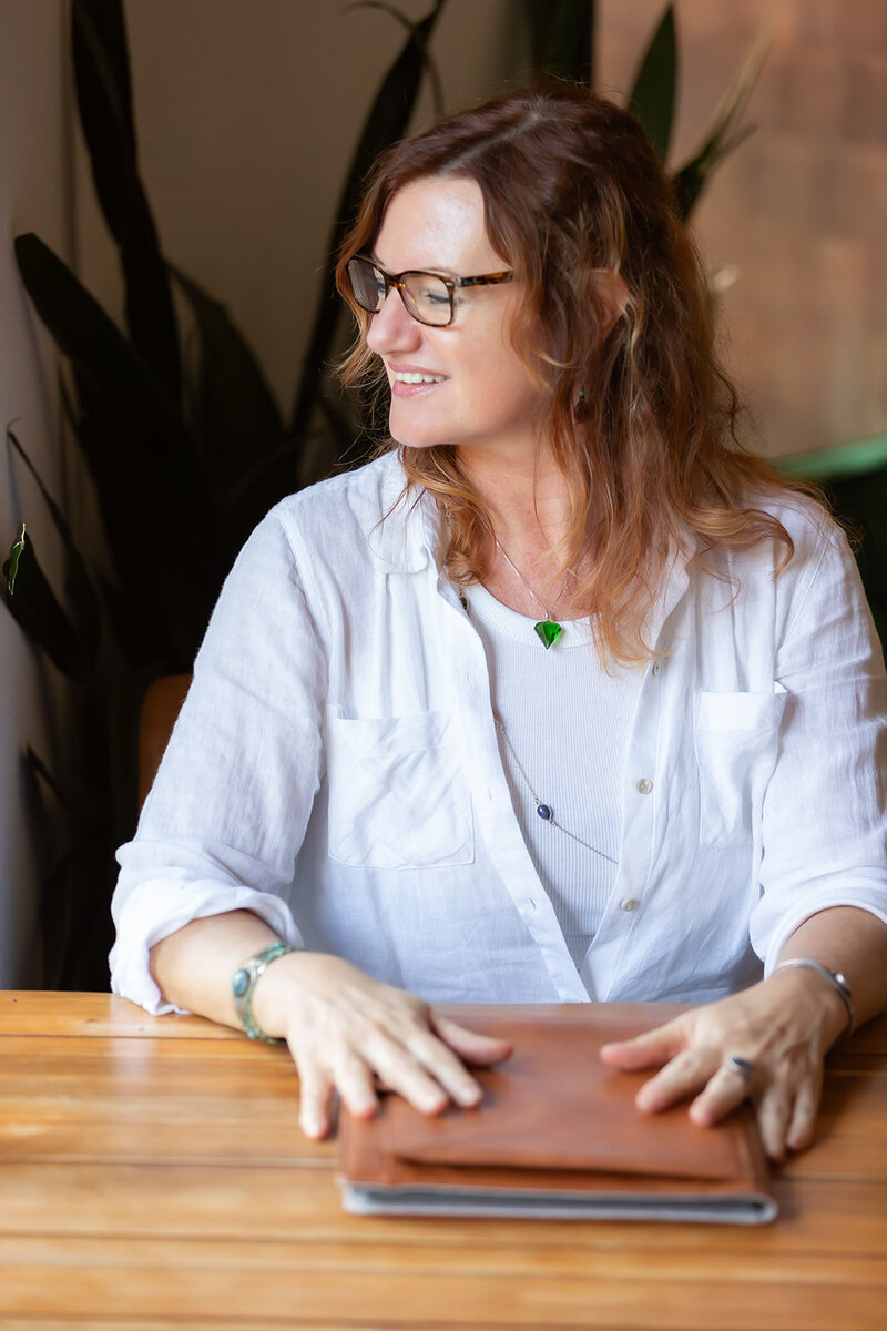 woman in glasses smiling