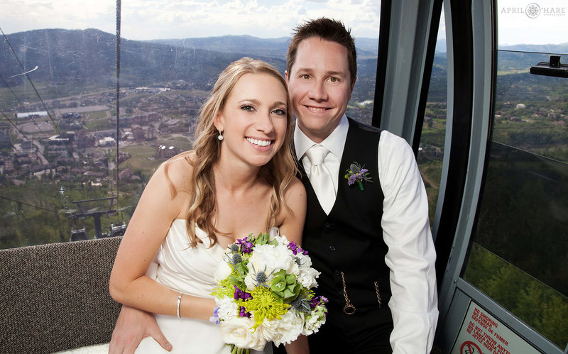 Fun gondola wedding photo of bride and groom in Steamboat Springs Colorado