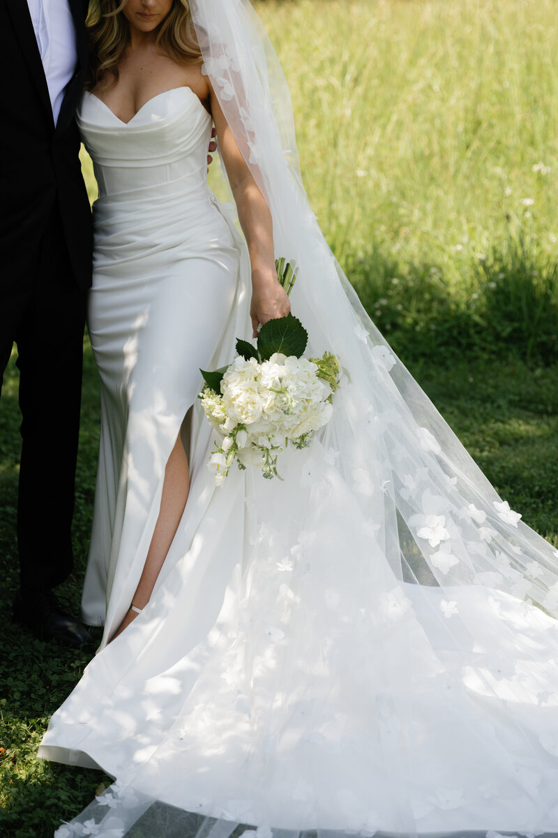 Bride and groom drinking together at an empty bar