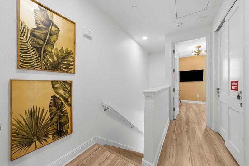 Tropical-themed hallway decor at Beach Cabana, a vibrant PCB vacation rental close to Pier Park, Thomas Drive, and 30A beach rentals.