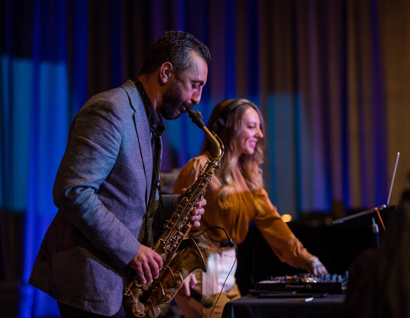 Saxophone plays along with a DJ for a corporate networking event at the MTCC