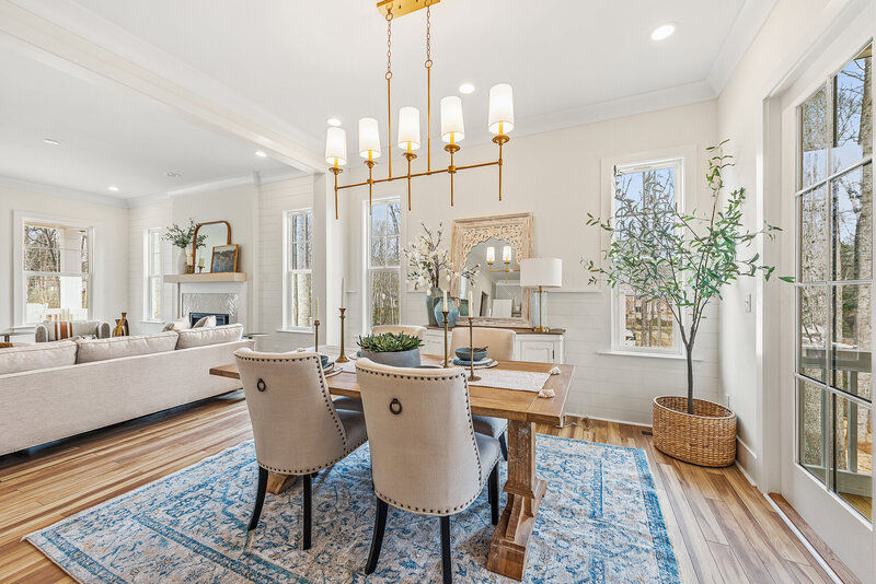 open concept dining room. A residential new construction project in which Gracious Home Interiors designed and staged a new construction home in Mint Hill, NC, with Bridwell Homes.