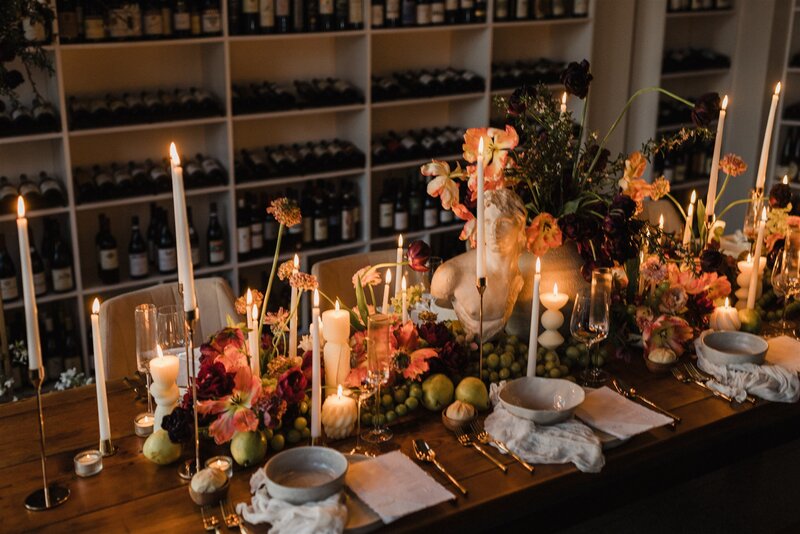 Modern baroque wedding table with sculpture, candles, and hellebore