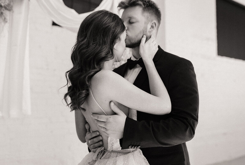 black and white photo of the couple sharing a special moment on wedding day