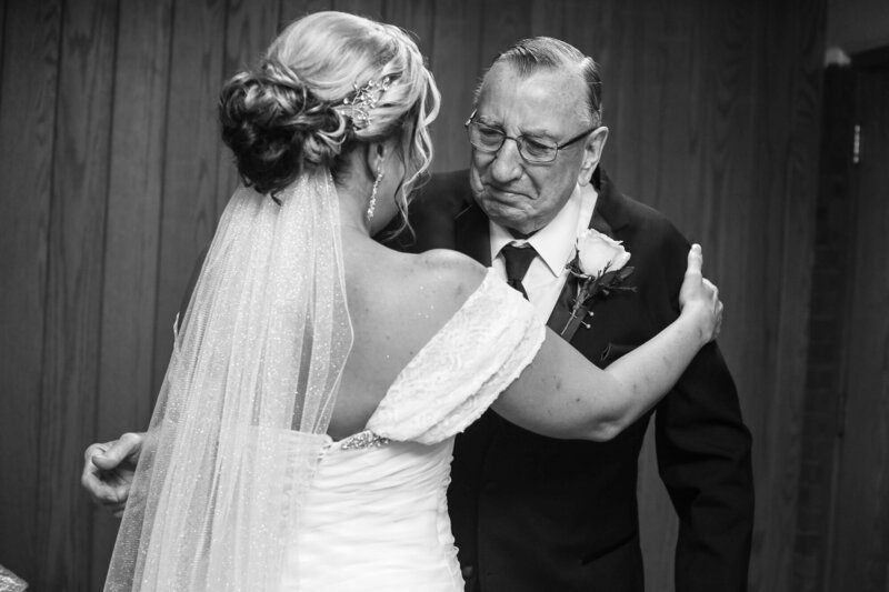Man begins to cry when he sees his daughter, the bride, in her wedding dress