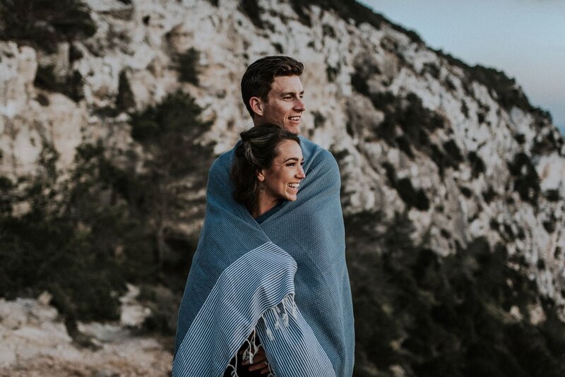 Devon Wedding Photographer Liberty Pearl stood with a man wrapped in a blue blanket