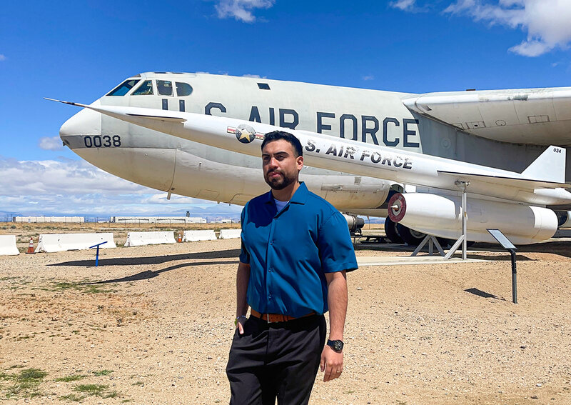 Adiran Esparza in front of US air force plane