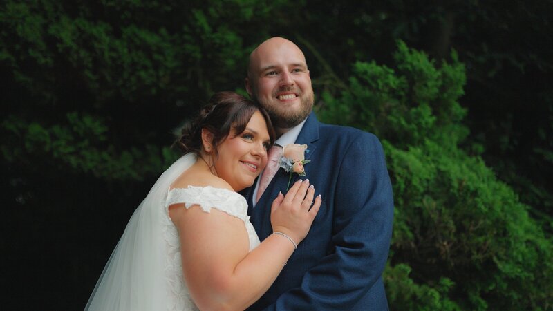 Bride and Groom stood in the gardens of Bartle Hall Hotel taken by Anthony Horseman Wedding Videographer