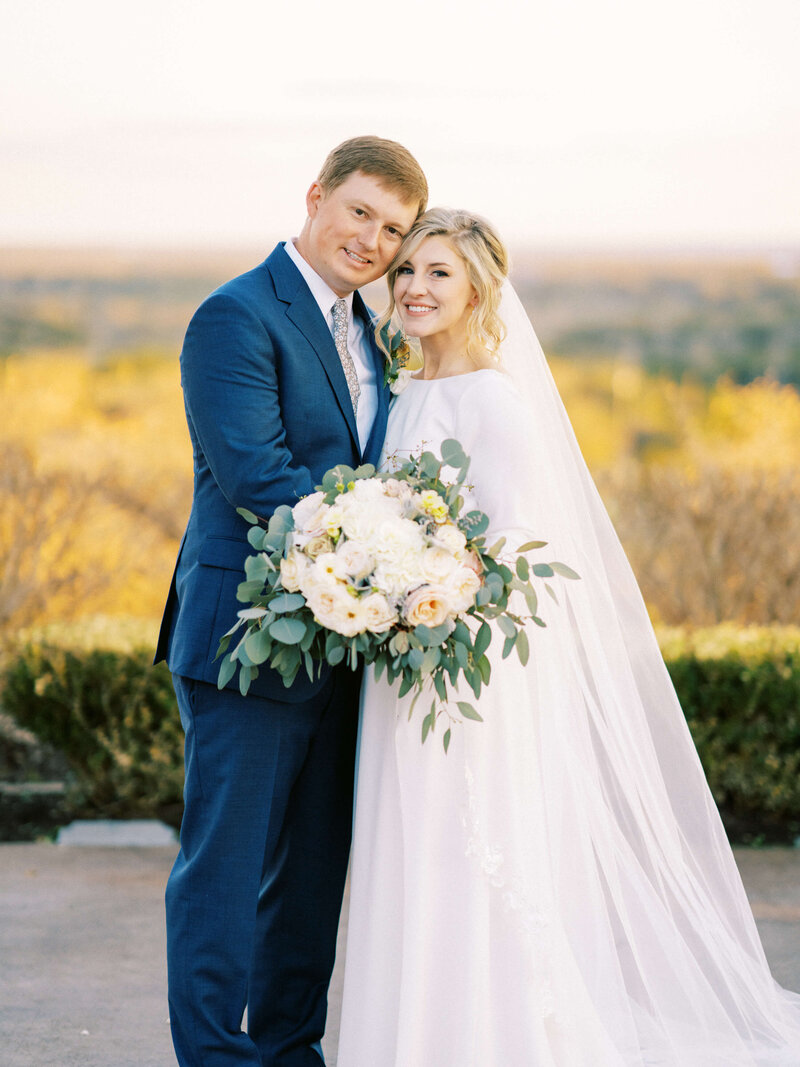 Texas bride and groom smiling at wedding at Canyonwood Ridge