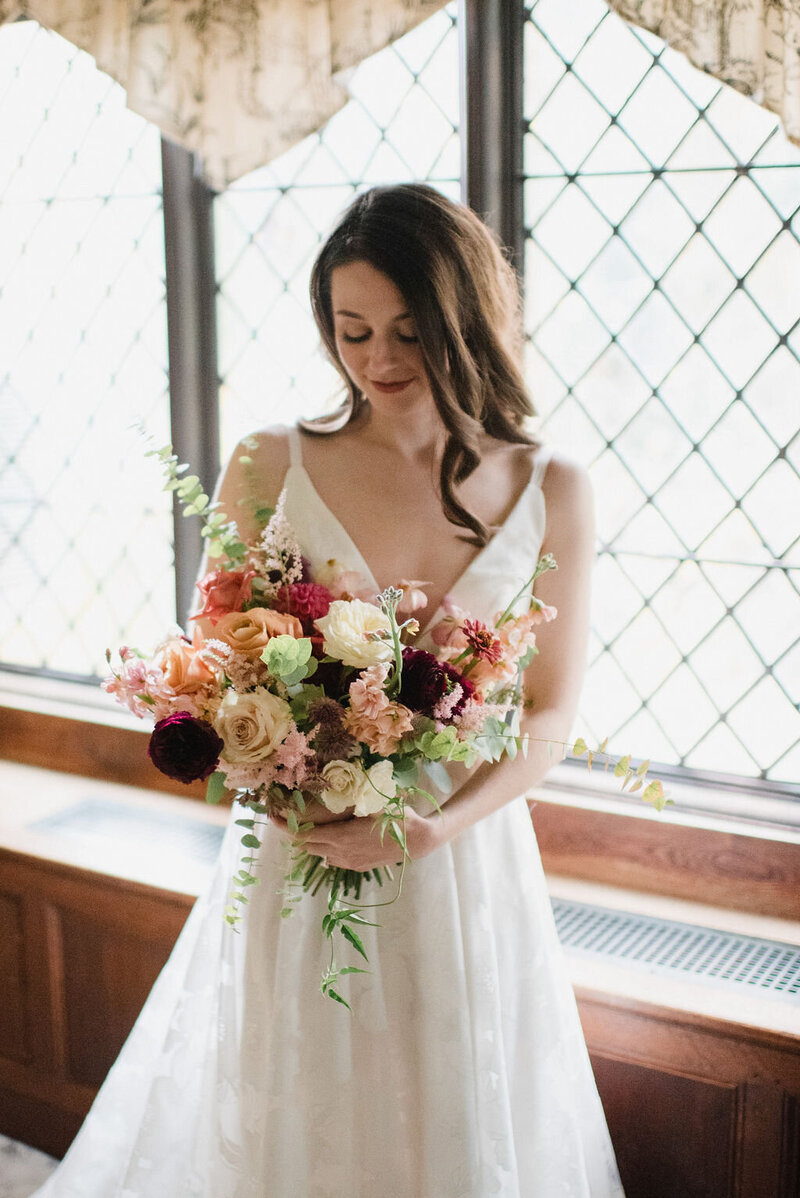 Photo of a boquet of flowers on a desk.