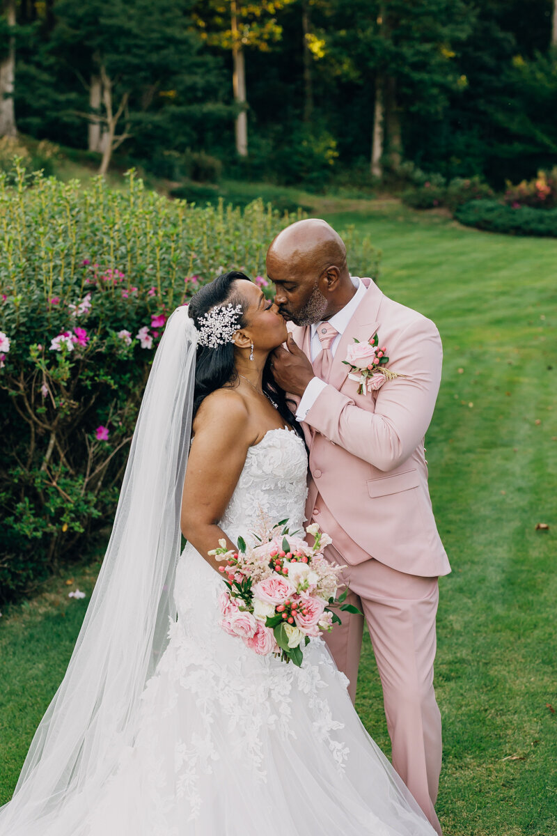 Groom kissing his bride following their ceremony at Greystone Estate in Ball Ground, GA