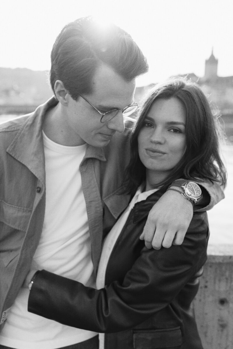 A couple during an engagement session on the bridge in the centre of Lucerne, Switzerland