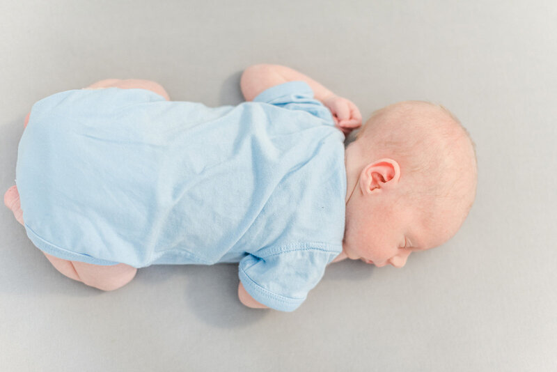 baby sleeping in crib by newborn photography baltimore md