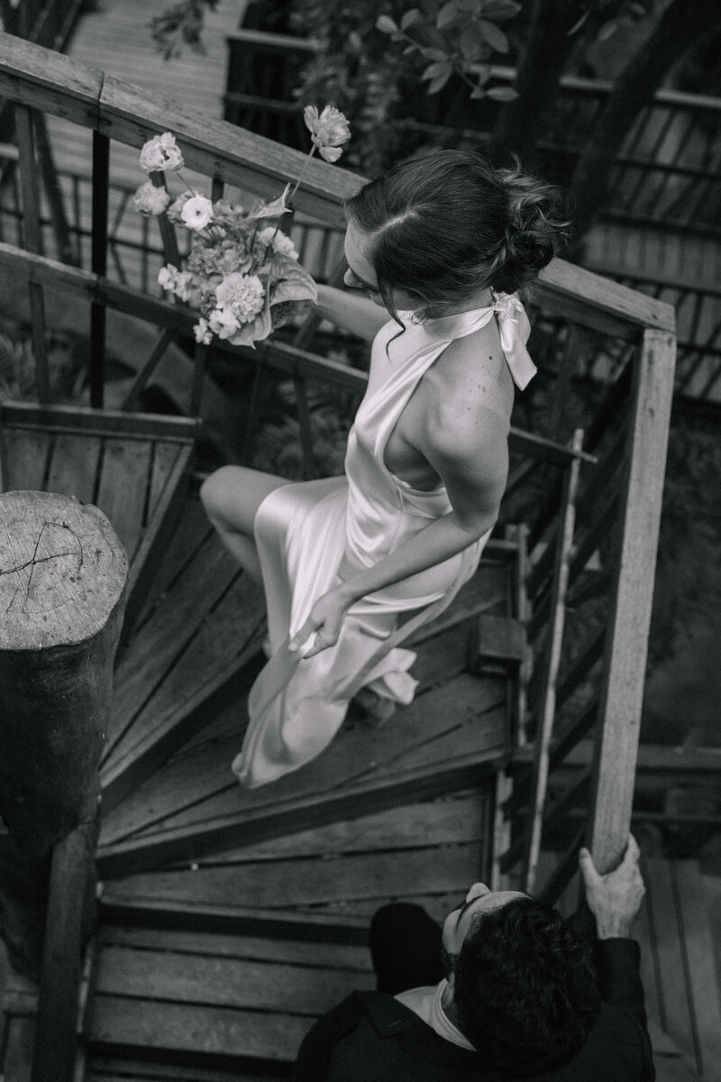 bride-and-groom-walking-up-stairs-nika-helgeson-photography