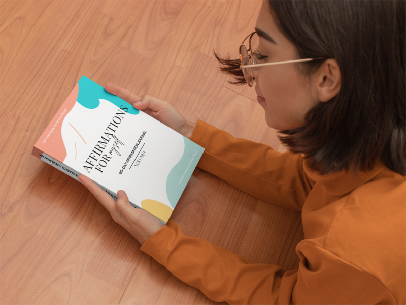 paperback-book-mockup-featuring-a-woman-lying-on-the-floor-31044