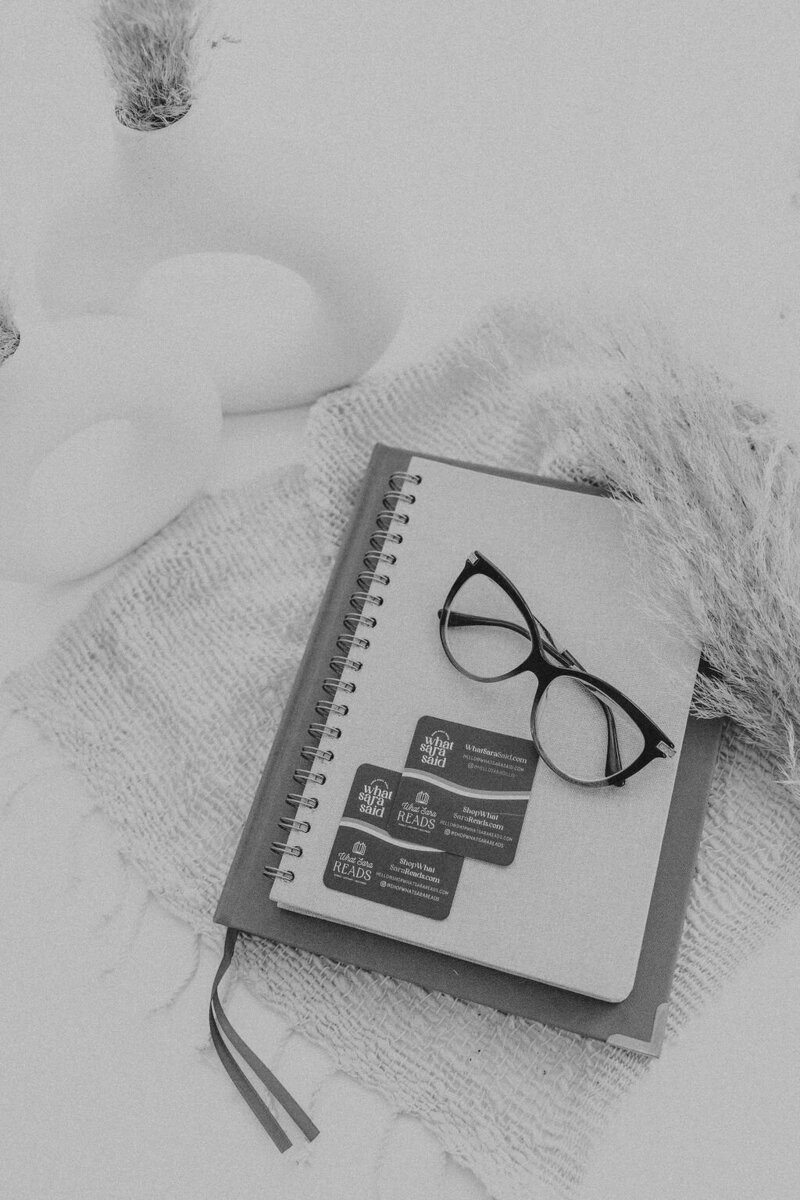 Copywriter Sara Gillis's hands writing in notebooks