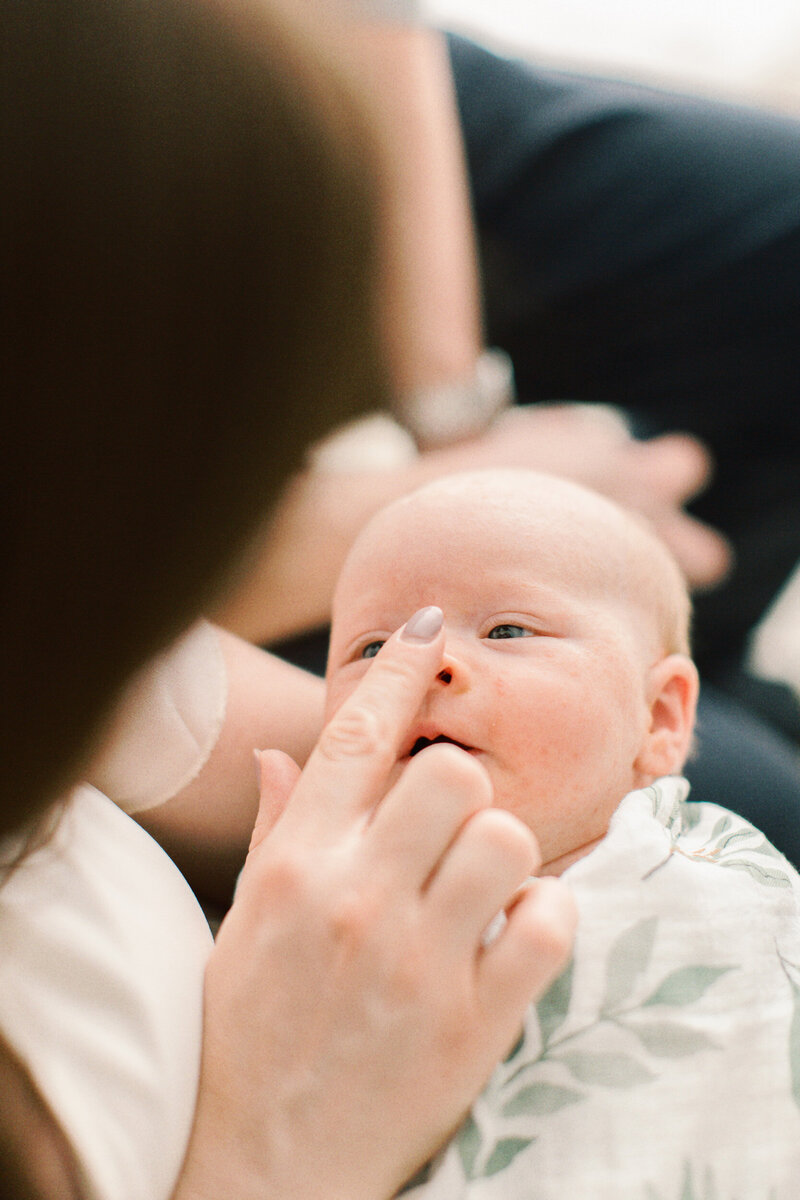 mom bopping babys nose by Chicago Newborn Photographer