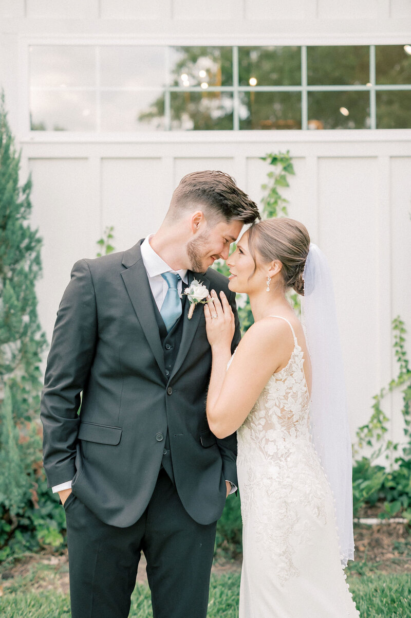 The RoseMary Wedding Venue | DFW Wedding Photographer Rae De Lain Light and Airy | Bride with hands on the groom's chest