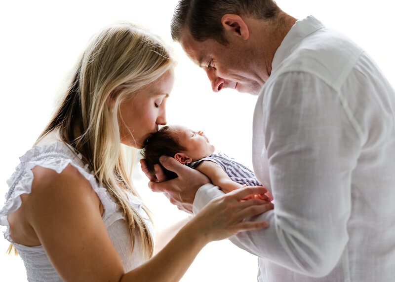 Backlit lifestyle newborn photo session in NJ client's home.