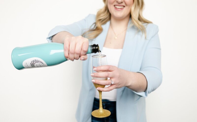 Woman pouring glass of champagne