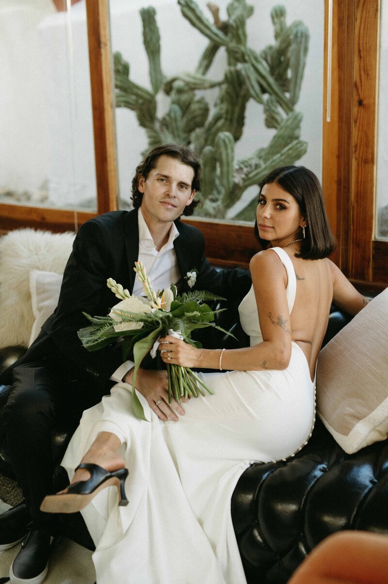 Bride and groom pose during their desert portraits
