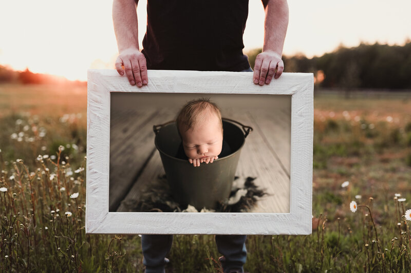 newborn in bucket framed print
