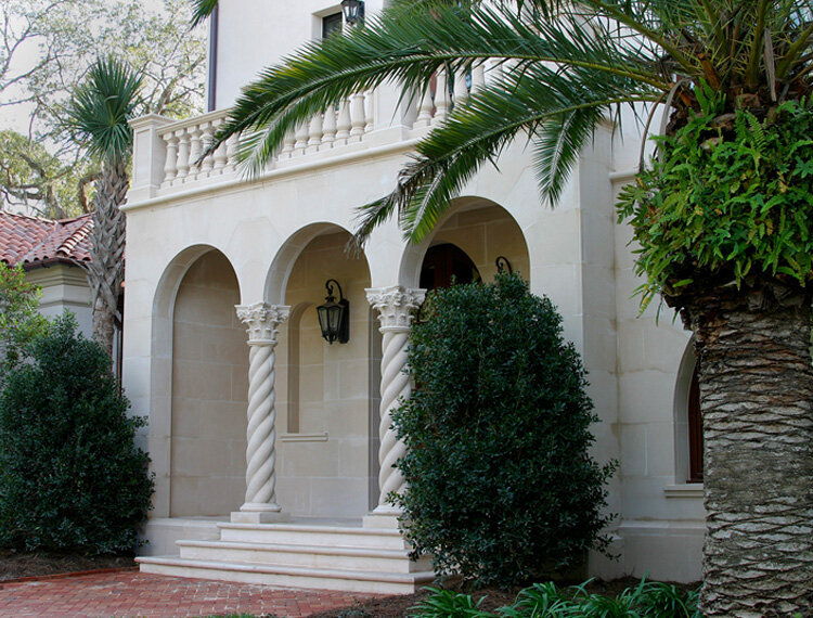 Mediterranean style home with decorative custom columns