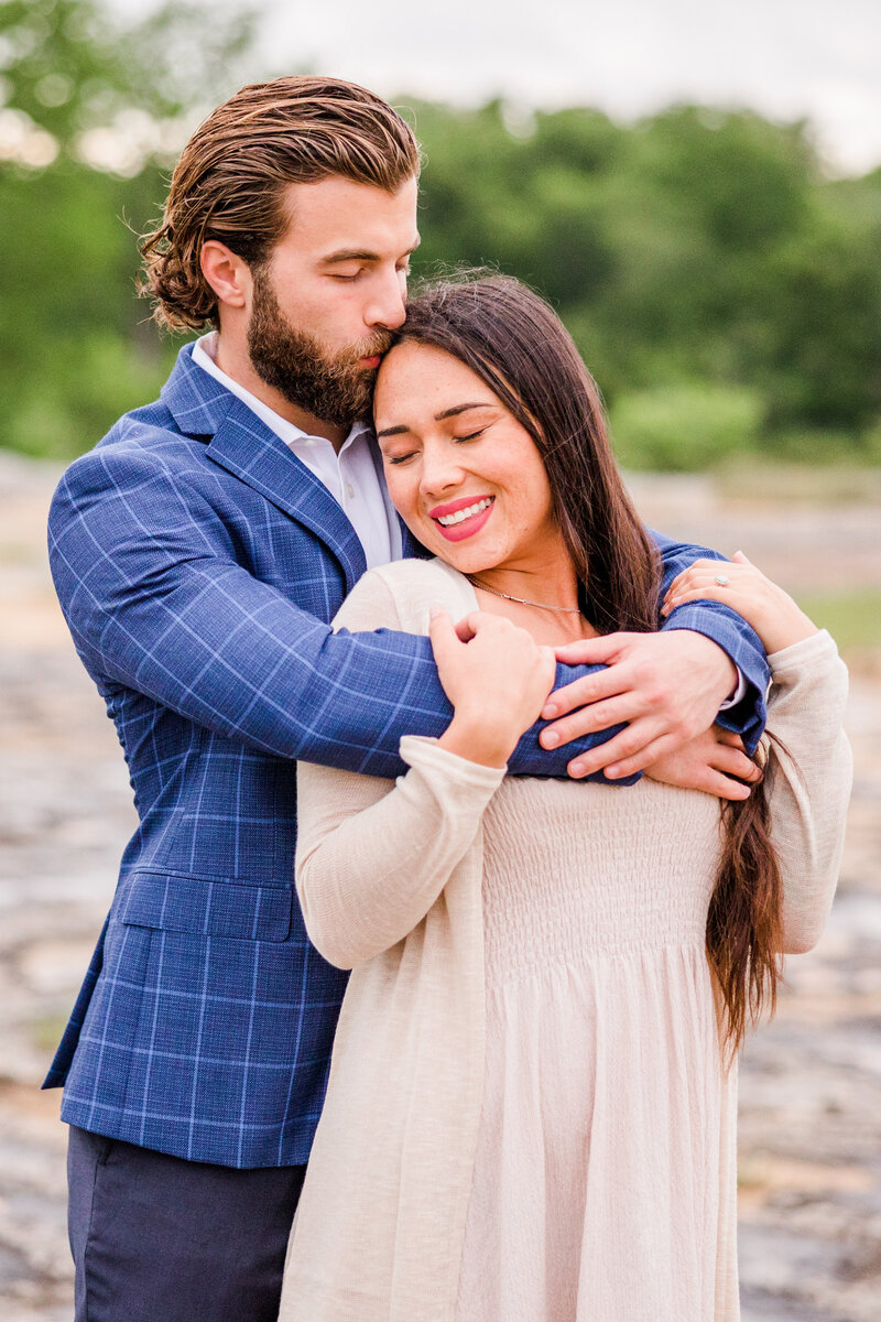 Couple's engagement session photo taken at Mckinney Falls State Park in Austin, Texas.