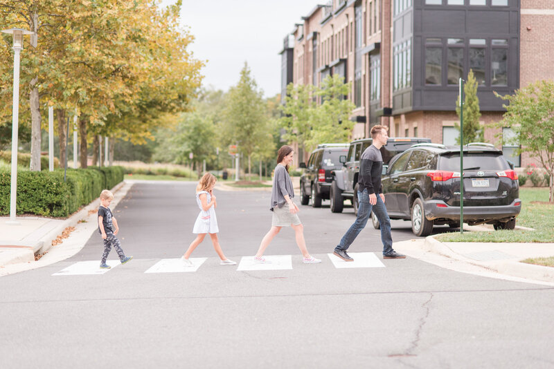 Family crossing the street in the style of Beatles cover "Abbey Road". Photo taken by Dripping Springs Texas Photographer, Lydia Teague.