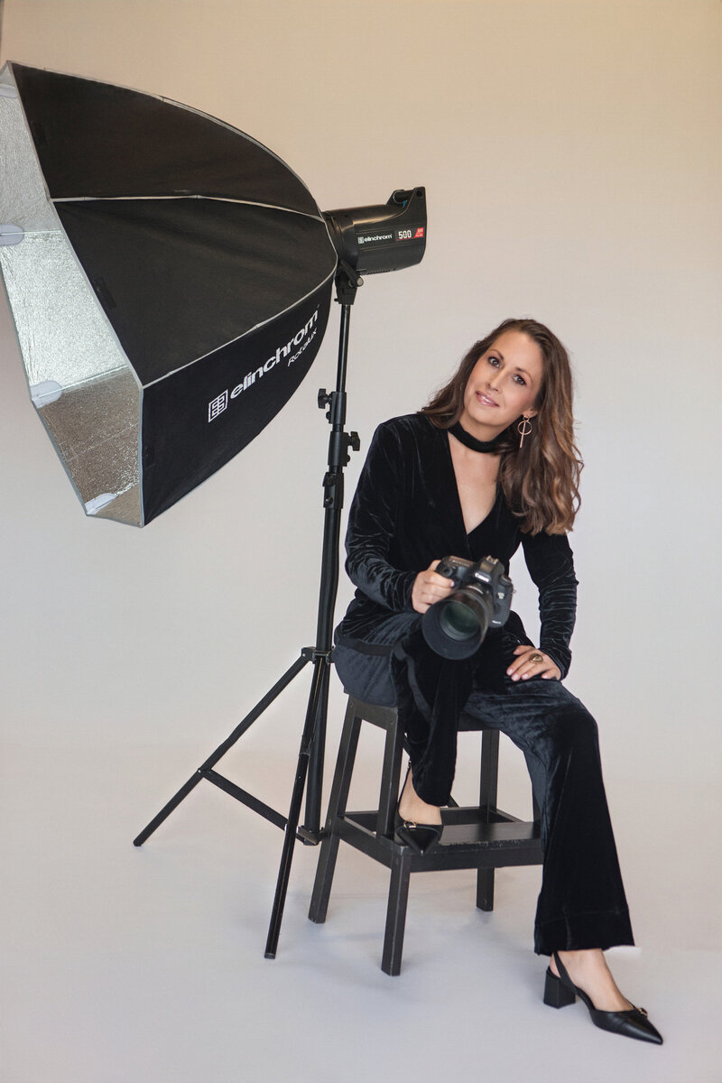 Ingrid Photographer at her studio in Terrigal at her desk.