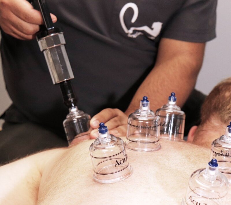 Licensed therapist delivering cupping massage at Apex Massage studio in Mexico City.