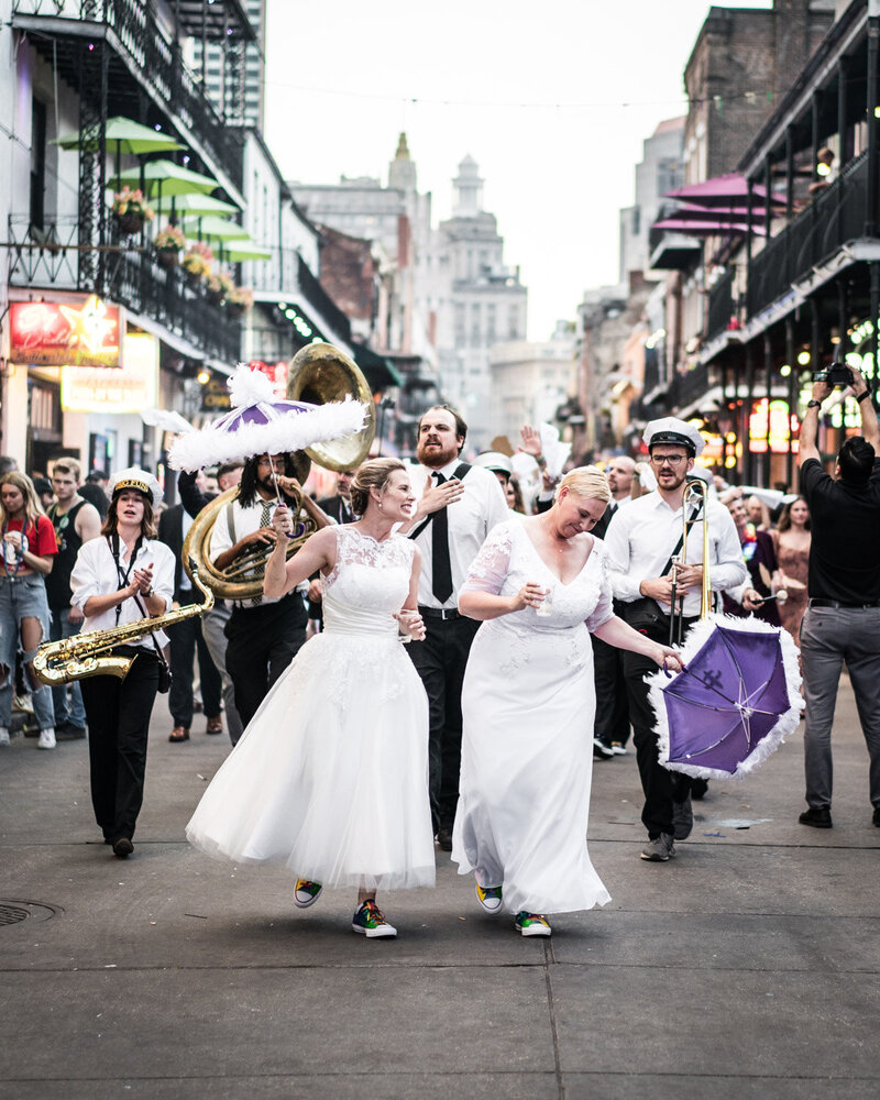 Brides in second line wedding parade down Bourbon Street