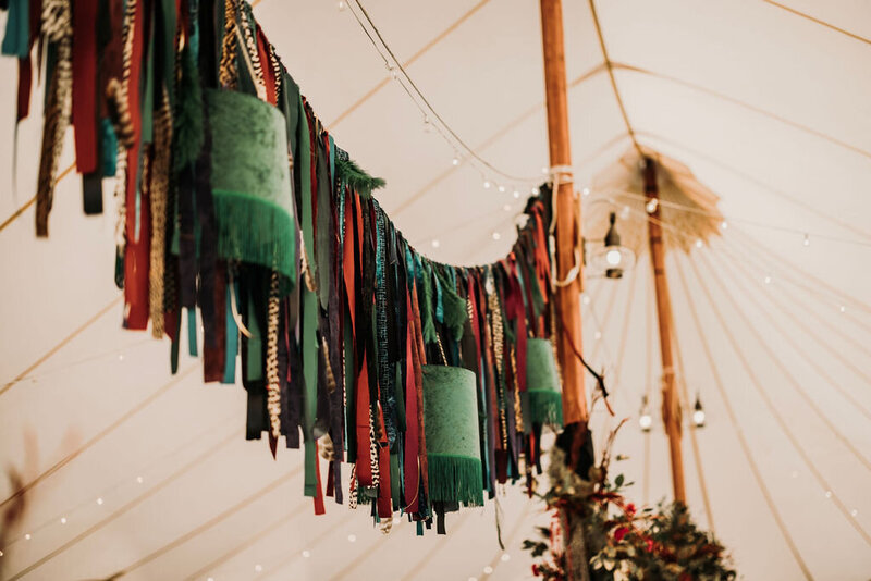 wedding tent  decor jewel tones fringe lamps sail cloth scarves scarf edgy design 
