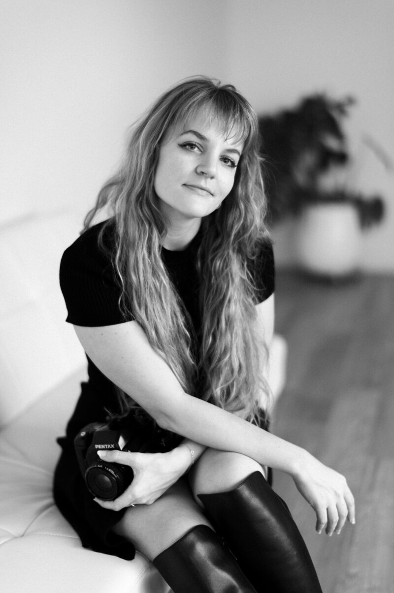 Portrait of Detroit, Michigan film wedding photographer Christina Harrison with film camera