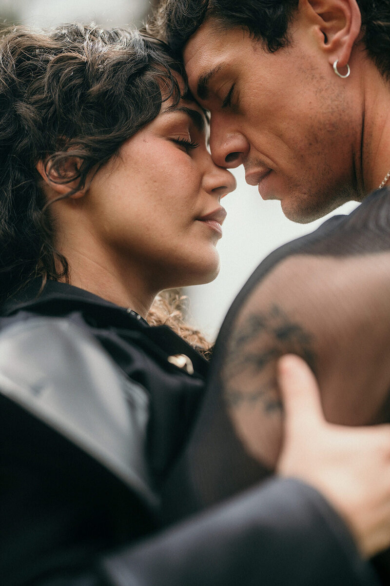 A couple holds their foreheads together with their eyes closed. Couple Photography Los Angeles.