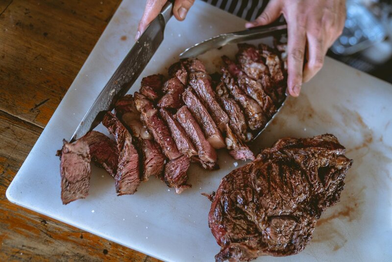 Person cutting up steak