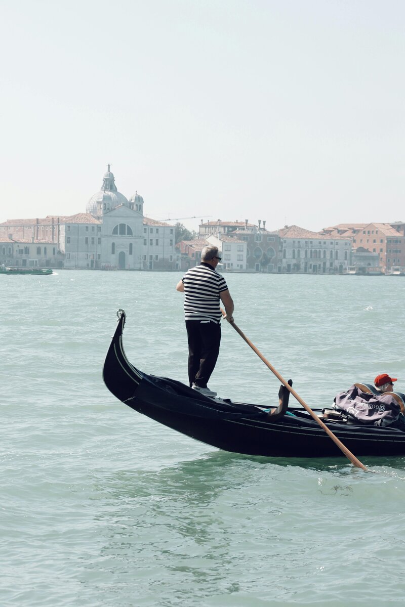 Traveler enjoying a gondola ride in Venice