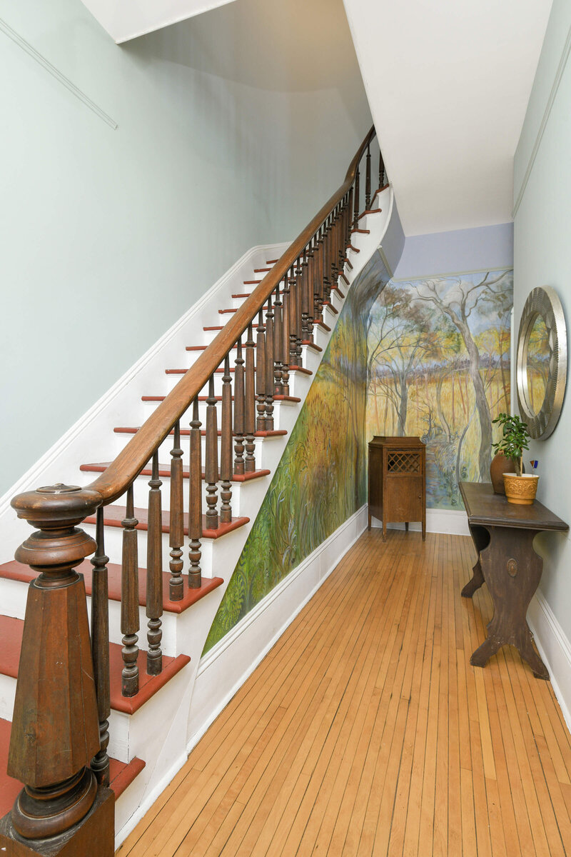 Staircase and entryway in St Paul vintage home