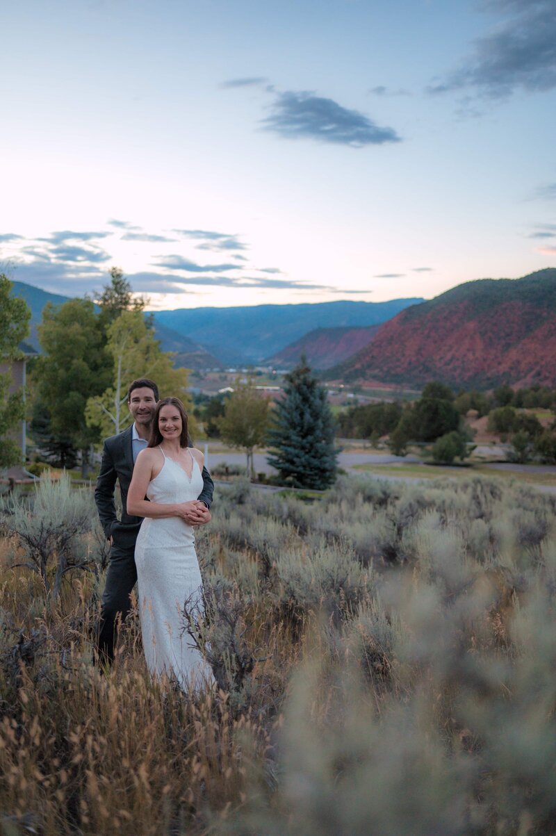 A couple shares a quiet moment during their elopement in Glenwood Springs, surrounded by Colorado’s natural beauty.
