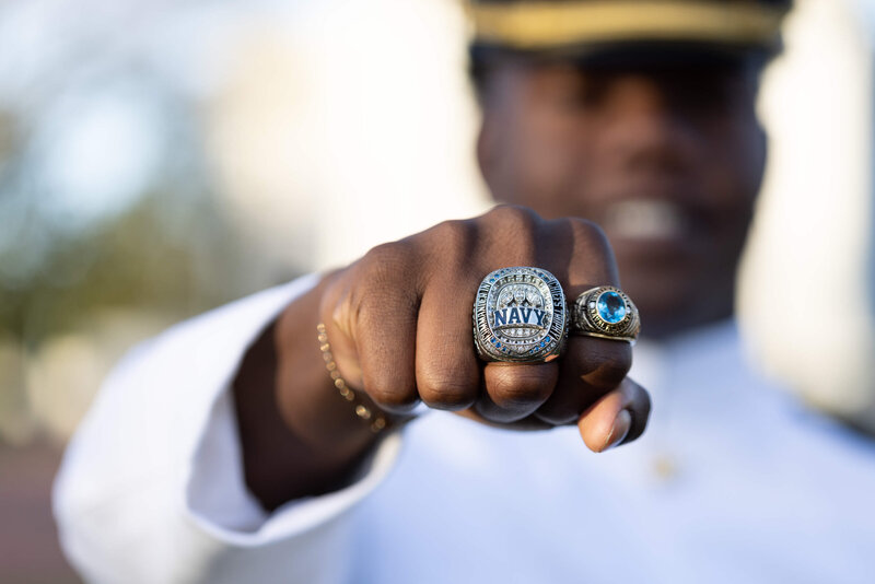 Navy Football Class Ring and Smiling Midshipman senior photo at the US Naval Academy.