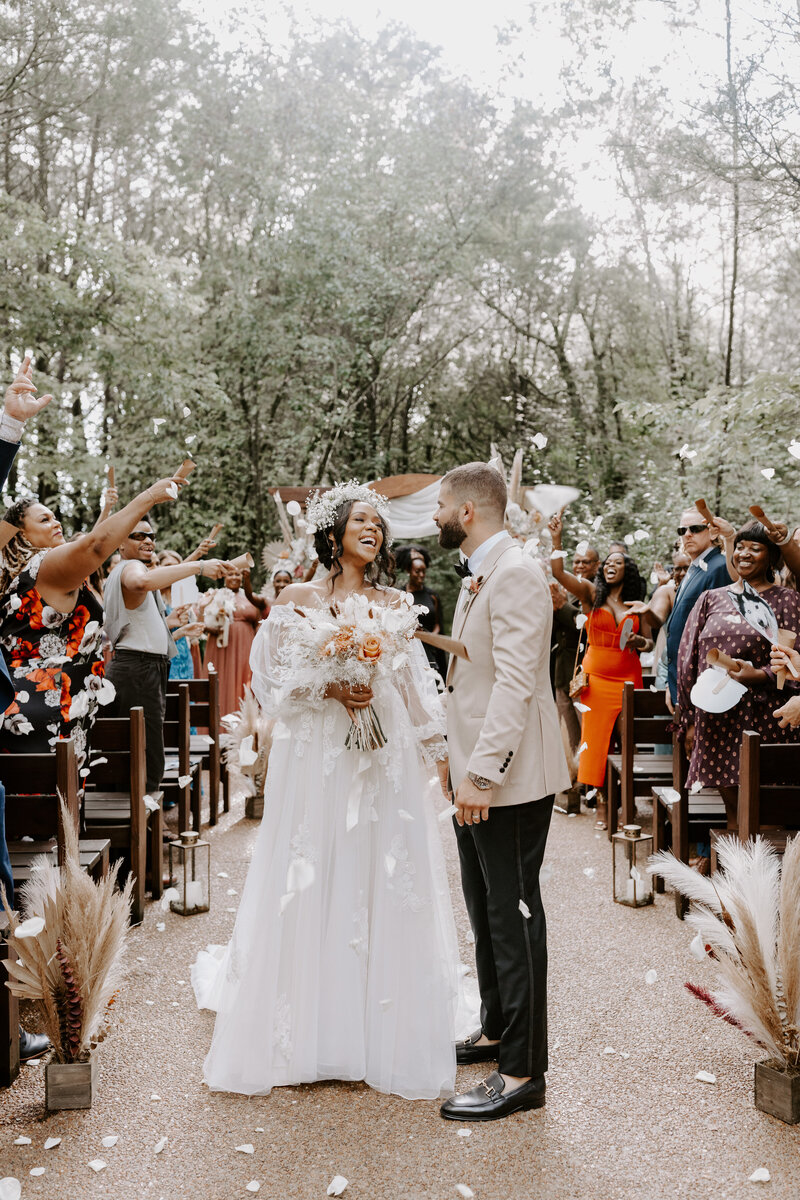 A bride and groom flower petals